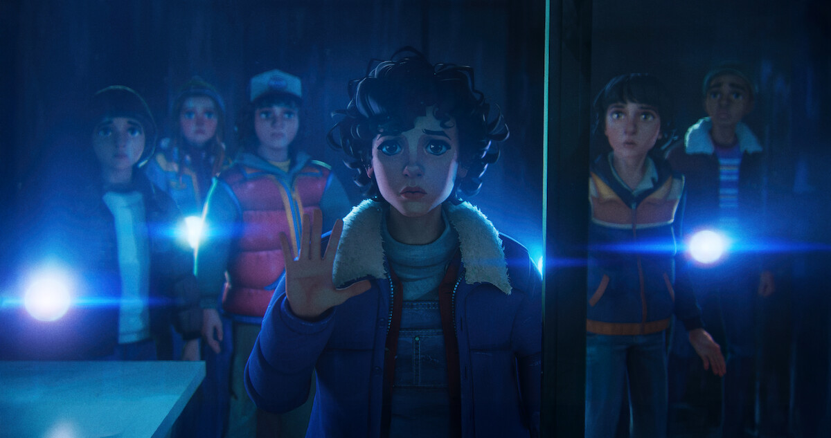 A group of animated kids in winter clothes stand in a dark, mysterious room, illuminated by blue flashlight beams. One child reaches toward a barrier with concern.
