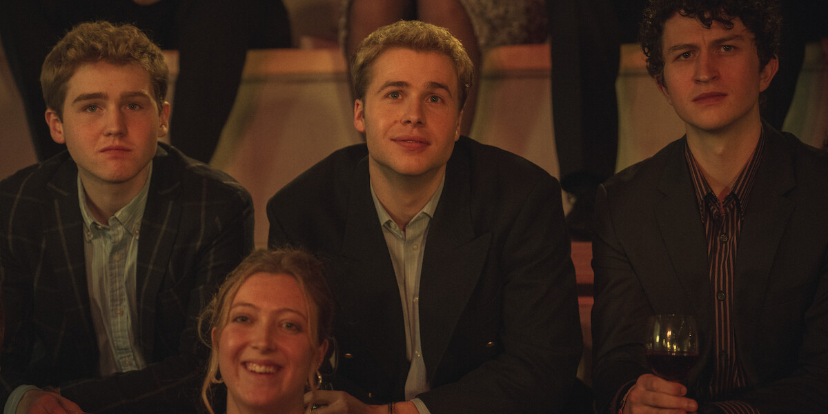 Ed McVey as Prince William swoons while he watches a fashion show in Season 6 Part 2 of ‘The Crown.’