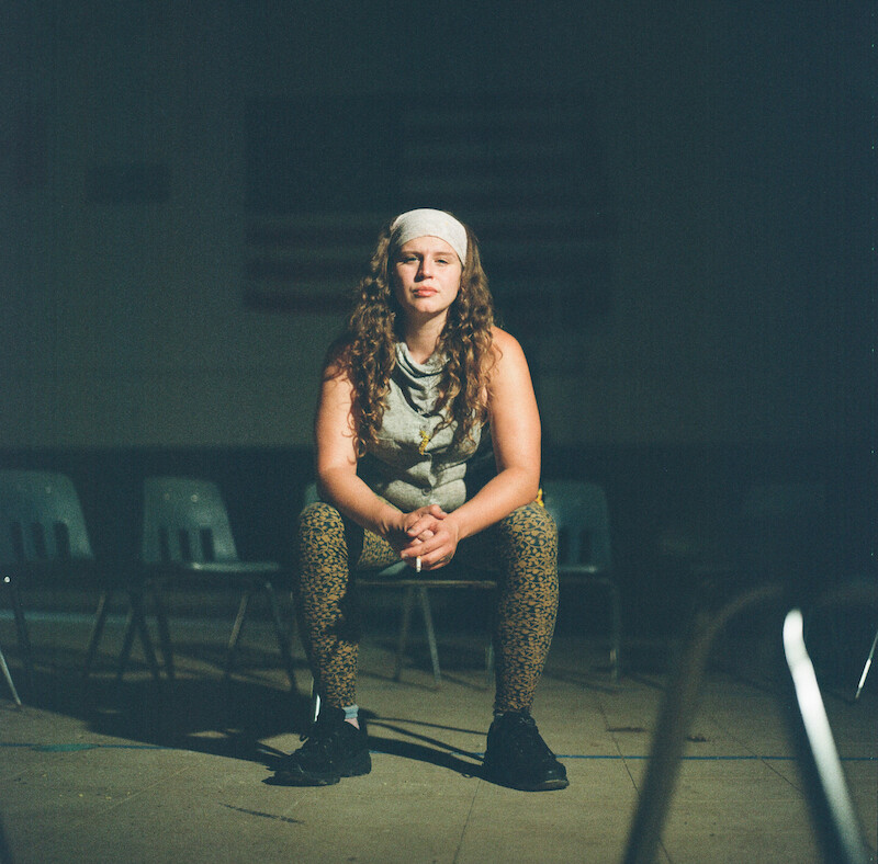Woman sitting in an empty chair at The Academy at Ivy Ridge. 