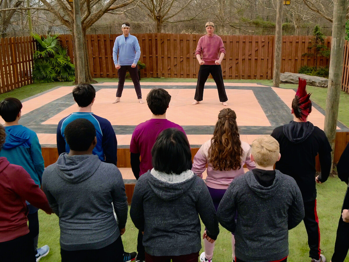 Daniel and Johnny train their students in both of their martial arts tactics