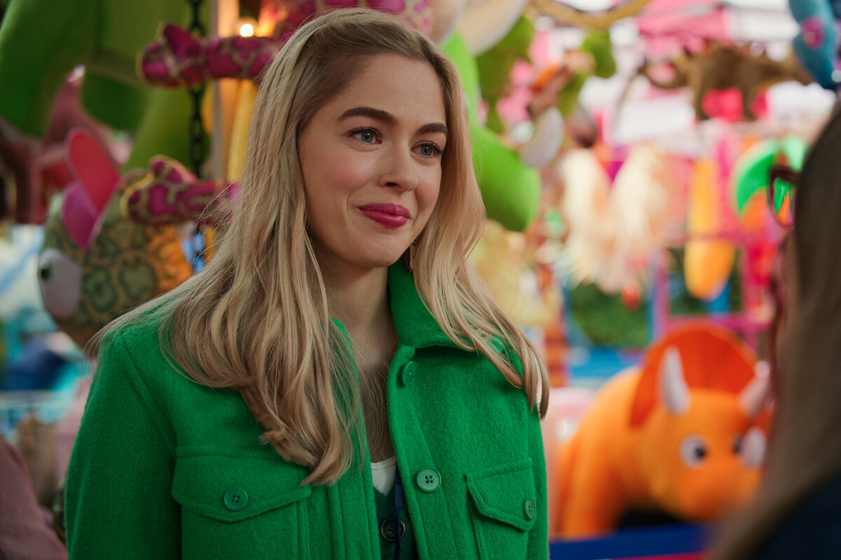 Sarah Dugdale as Lizzie smiles at a carnival in Season 5 of ‘Virgin River.’