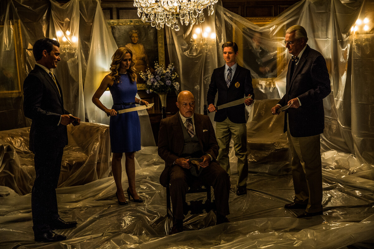 John Beasley as Papa Rico sits in the home of a wealthy family waiting to be sacrificed in ‘The Purge: Anarchy.’