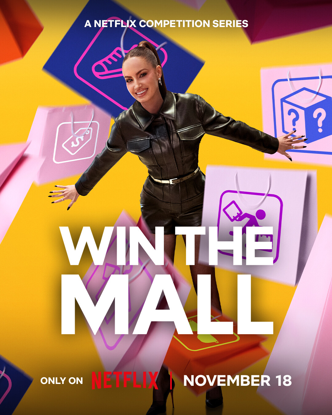 A smiling woman in a dark outfit posing with arms outstretched against a colorful background of illustrated shopping bags, promoting the Netflix competition series "Win The Mall," premiering November 18.