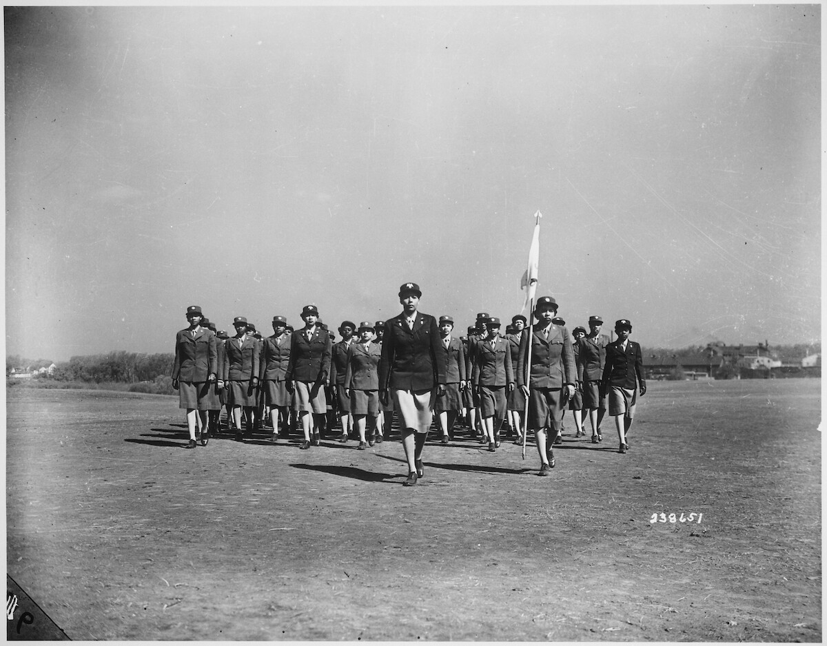 Captain Charity Adams of Columbia, NC marches ahead of the 6888th Battalion.