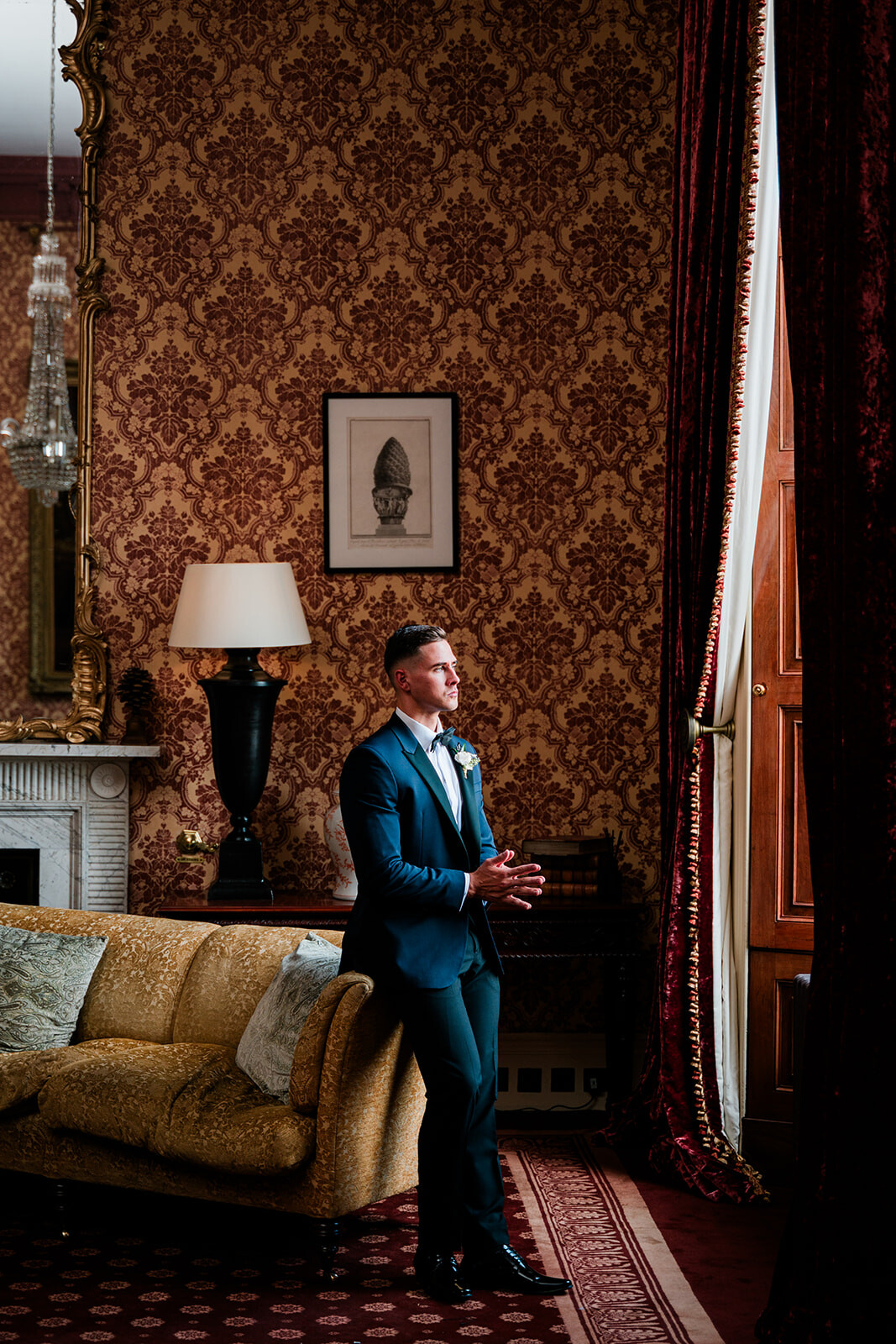 Freddie looks out the window in his wedding tux.