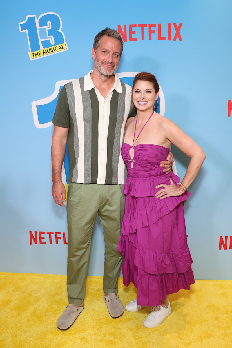 Peter Hermann (left) and Debra Messing (right) on the 13: The Musical yellow carpet. ‘13: The Musical’ Red Carpet Premiere