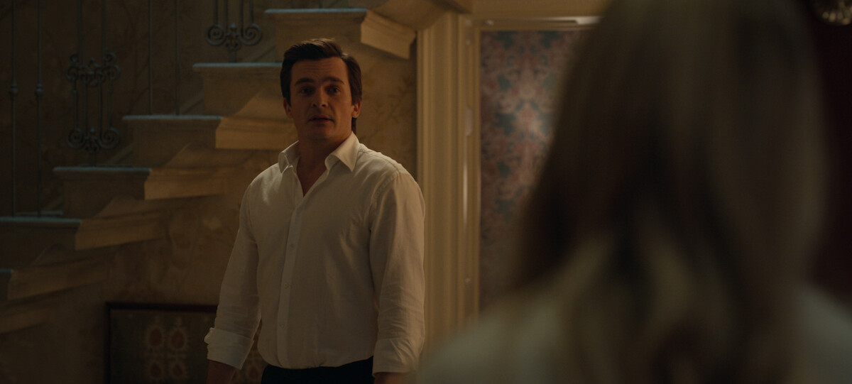 A look at the open stairwell behind Rupert Friend in the series Anatomy of a Scandal