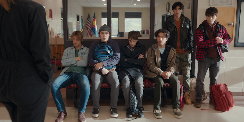 Noah LaLonde as Cole, Connor Stanhope as Danny, Corey Fogelmanis as Nathan, Myles Perez as Lee, Isaac Arellanes as Isaac and Ashby Gentry as Alex sit on a bench at school in Season 1 of ‘My Life with the Walter Boys.’