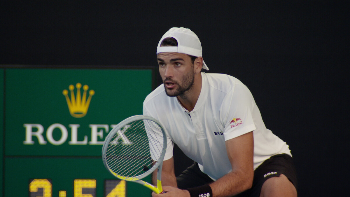 Matteo Berrettini prepares to receive a serve.