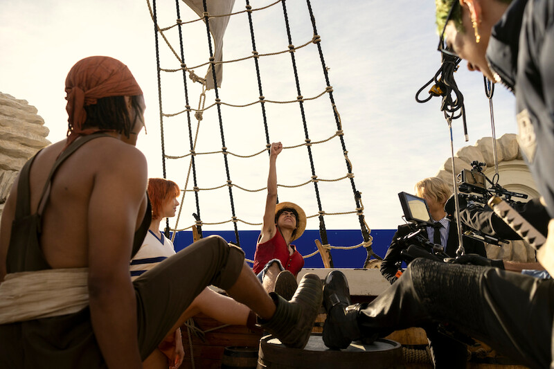 Iñaki Godoy as Monkey D. Luffy putting his fist in the air on set of Season 1 of 'One Piece.'