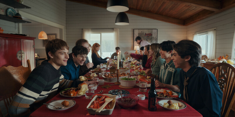 Friends enjoy a meal together in ‘My Life with the Walter Boys.’