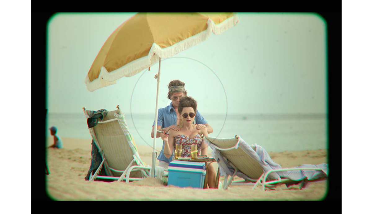 Princess Margaret getting her shoulders rubbed at the beach