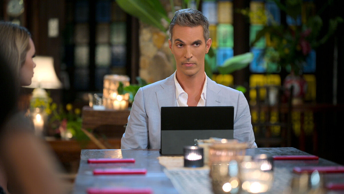 Ari Shapiro sits behind a tablet.