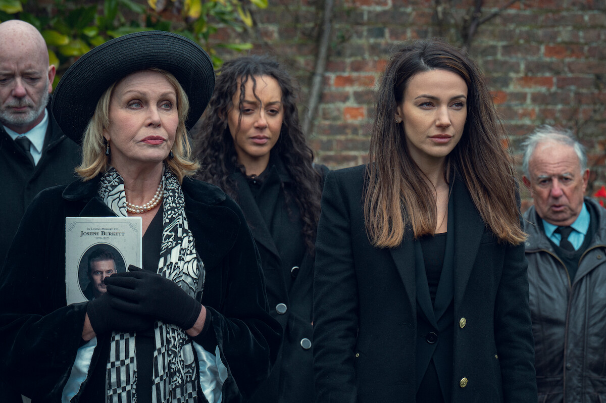 Joanna Lumley as Judith Burkett and Michelle Keegan as Maya Stern stand at a funeral in the series ‘Fool Me Once.’