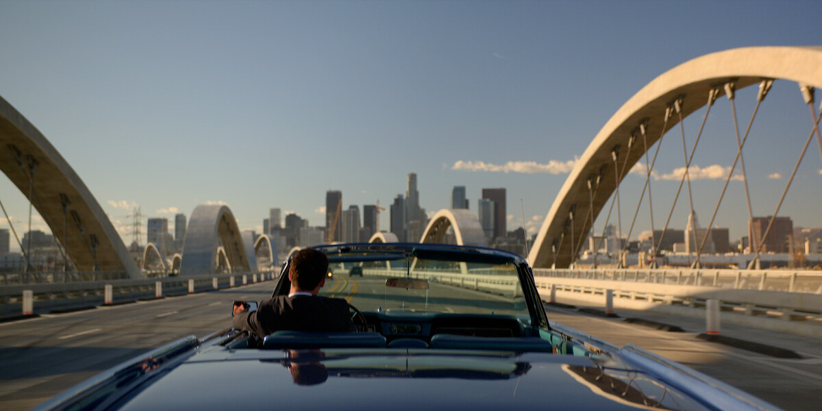 Manuel Garcia-Rulfo as Mickey Haller drives on the 6th Street Bridge in ‘The Lincoln Lawyer’ Season 2.