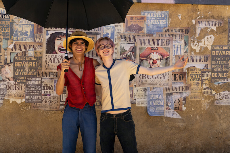 Iñaki Godoy as Monkey D. Luffy and Morgan Davies as Koby posing for a photo on the set of Season 1 of 'One Piece.'