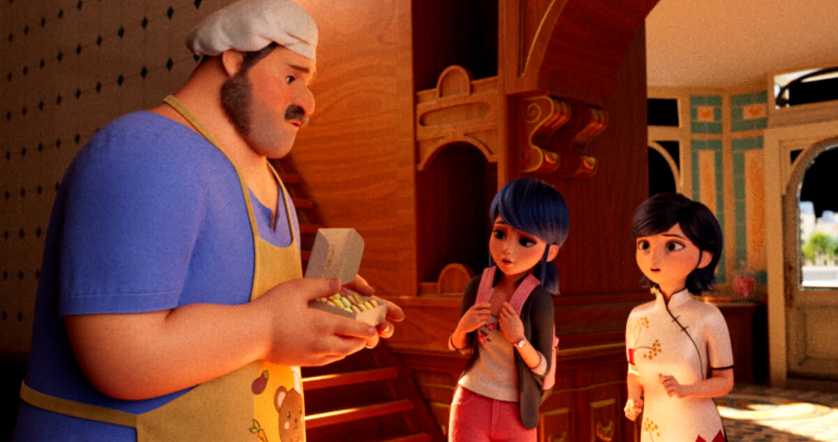 Marinette talks with a friend in the school hallway