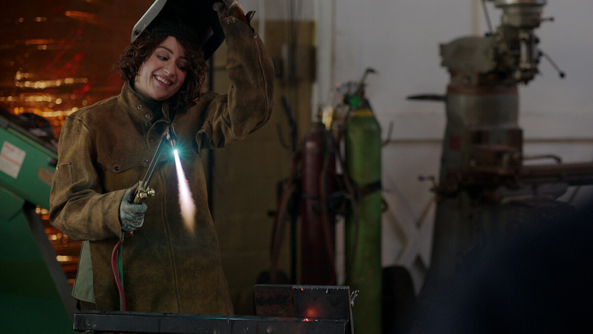 A person holding a welding torch