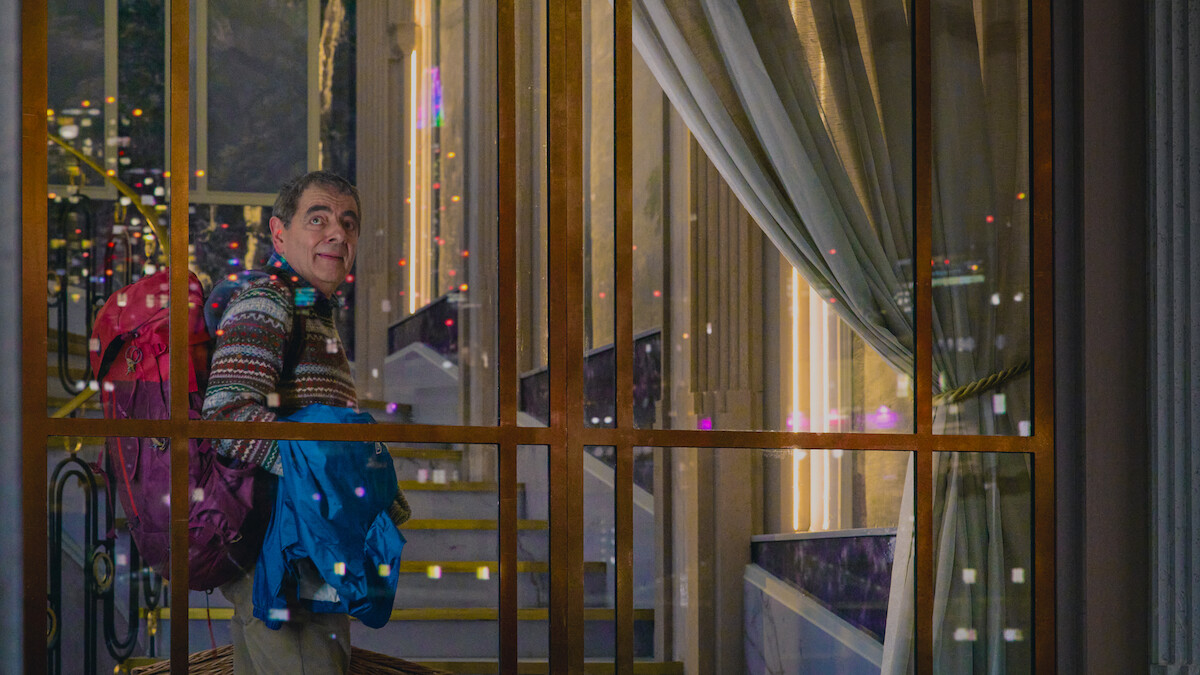 Rowan Atkinson as Trevor Bingley walks to his housesitting job in ‘Man Vs Baby.’