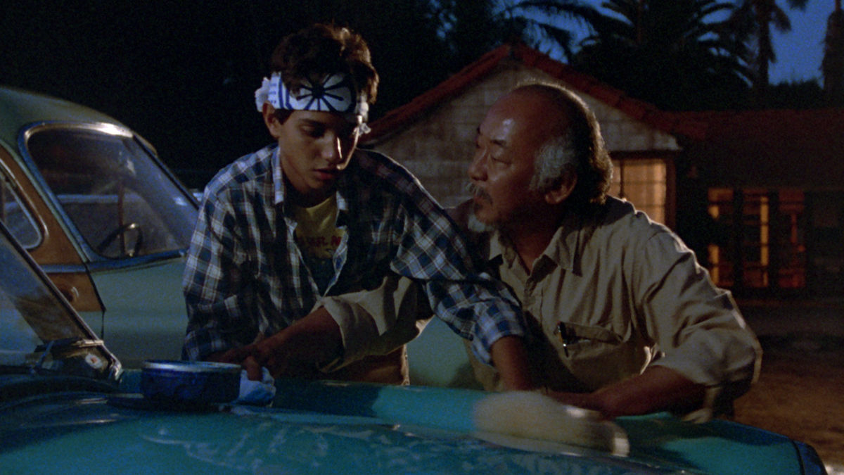 Mr. Miyagi teaches young Daniel about the