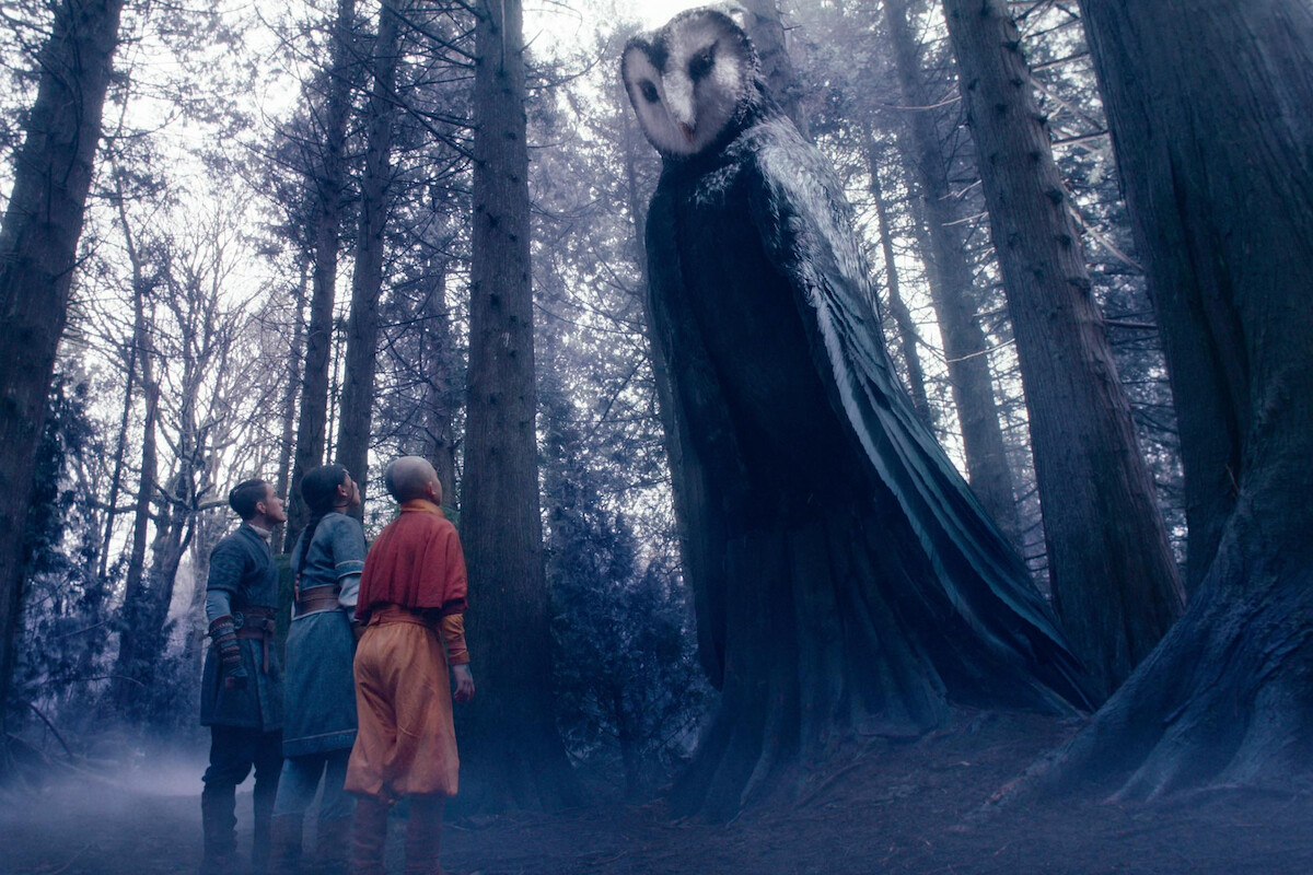Ian Ousley as Sokka, Kiawentiio as Katara, Gordon Cormier as Aang speak to Wan Shi Tong, a giant owl spirit, voiced by Randall Duk Kim, in season 1 of ‘Avatar: The Last Airbender’
