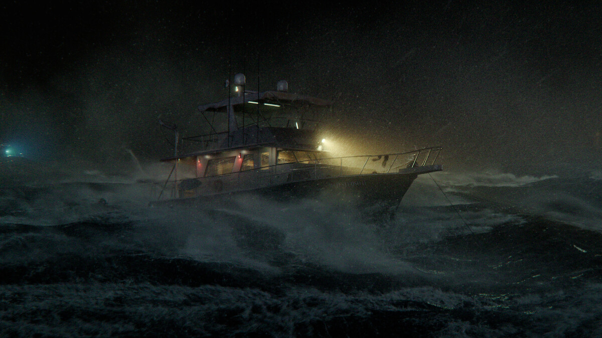 A fishing boat struggles in rough, stormy seas at night, illuminated by onboard lights while waves crash around it, creating a dramatic and tense maritime scene.