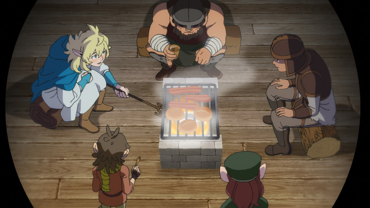 In an image from the animated series ‘Delicious in Dungeon,’ five characters sit around a fire.