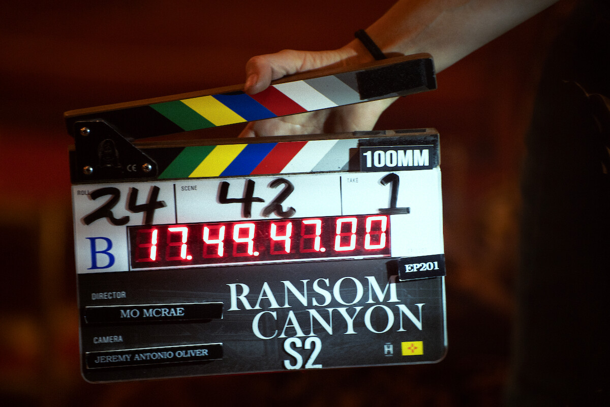 A hand holds a ‘Ransom Canyon’ Season 2 film slate.