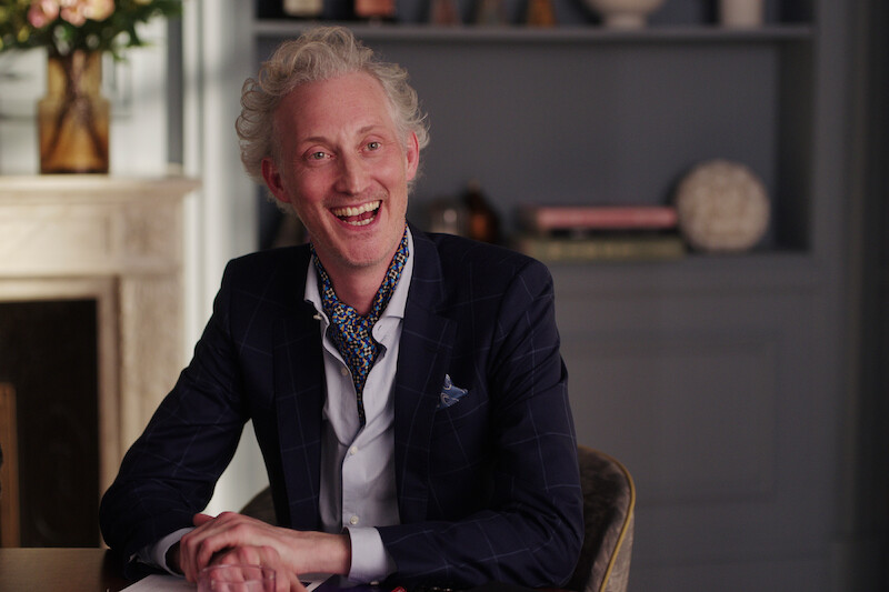 Bruno Gouery as Luc smiled widely in Season 4 of 'Emily in Paris'