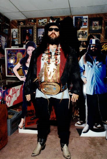 Buffalo Jim, wearing his signature gear, treasured his vast collection of unique wrestling memorabilia, which filled both his home and auto shop.  - ‘Unsolved Mysteries’ Volume 3 Bonus Material - Photos of Buffalo Jim 