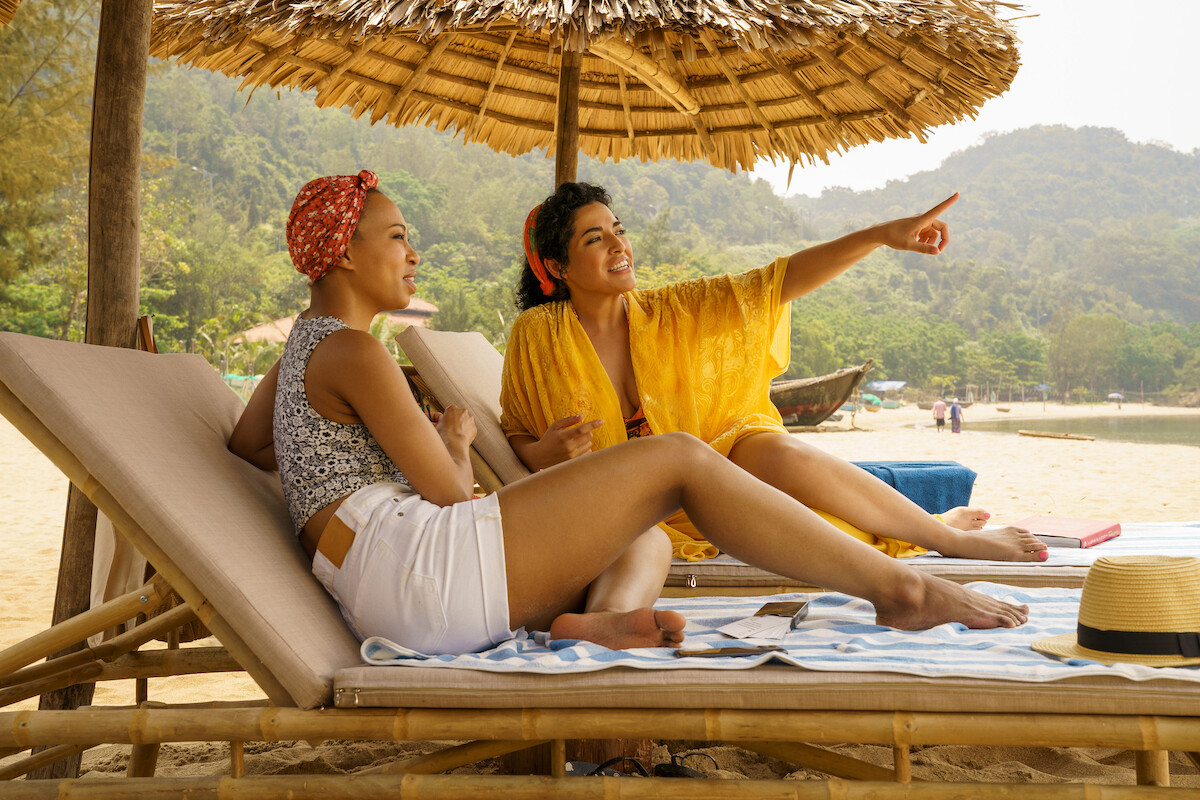 Two women sit in beach chairs in a still from ‘A Tourist’s Guide to Love.'