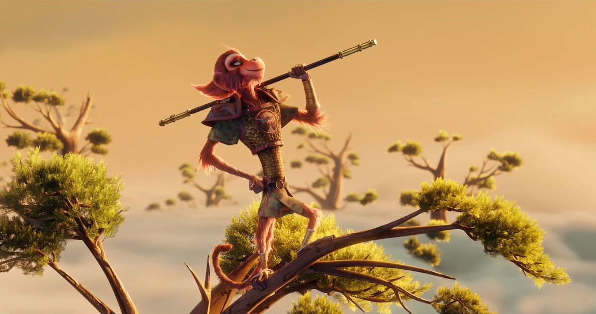 Still image from 'The Monkey King' showing the character called The Monkey King holding his magical stick atop a tree.