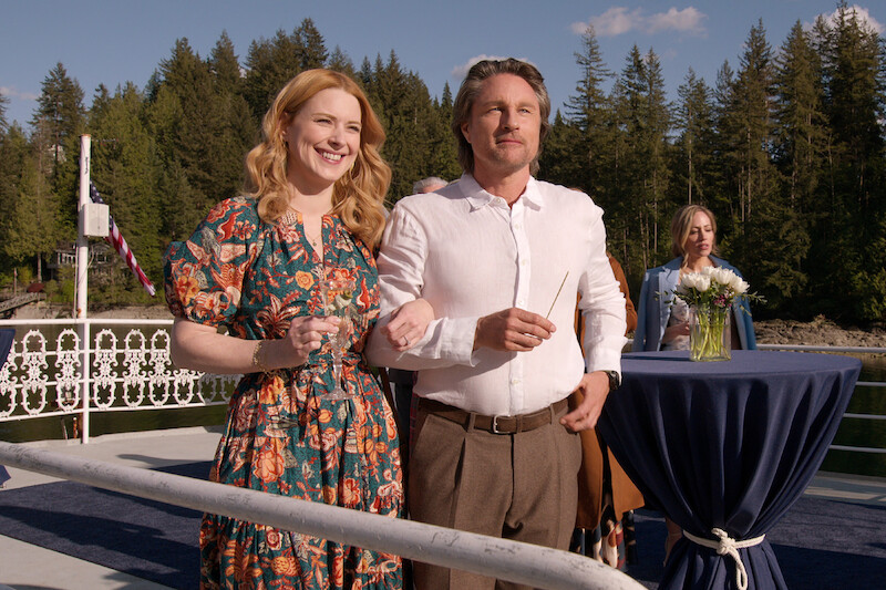 Martin Henderson as Jack Sheridan and Alexandra Breckenridge as Mel link arms and smile together in Season 6 of 'Virgin River.' 