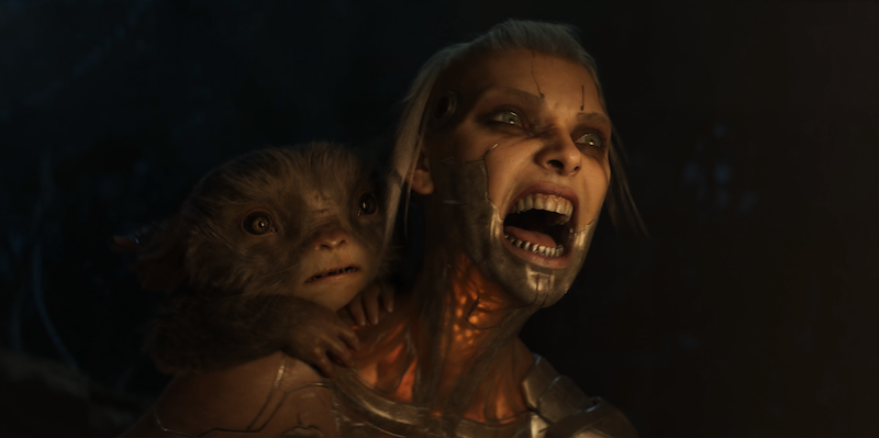 A cyborg woman with metallic facial implants screams fiercely, while a small, wide-eyed creature clings to her shoulder, both lit by a dim, dramatic glow in a dark environment.