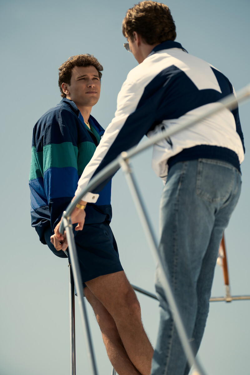 Erik (Cooper Koch) and Lyle Menendez (Nicholas Alexander Chavez) stand on the bow of a boat.