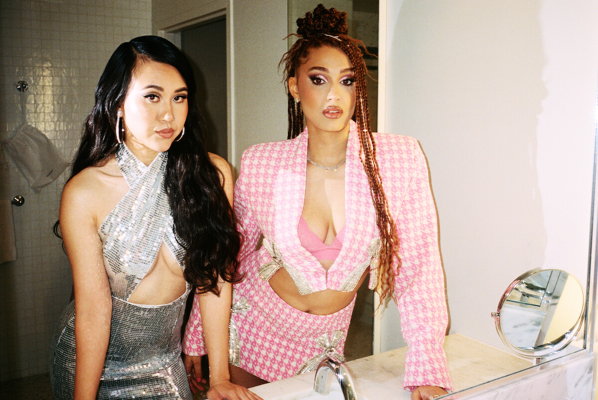 Ramona Young and Lee Rodriguez posing in the bathroom mirror.