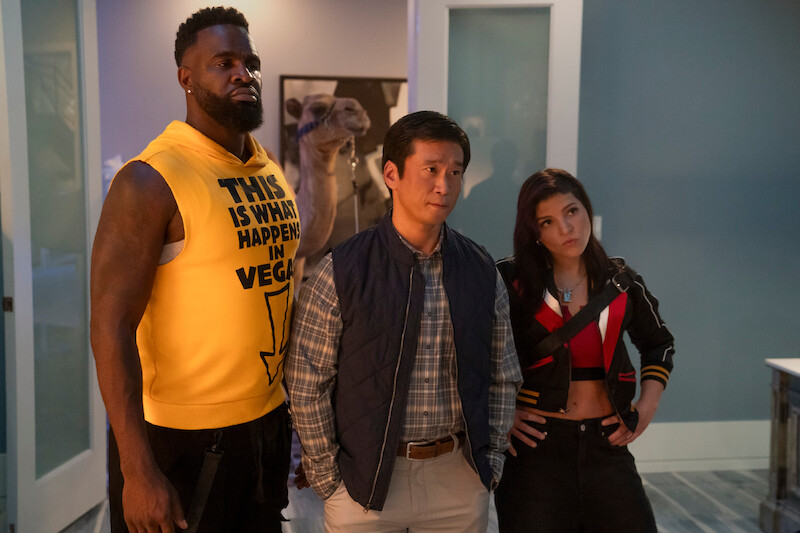 Terrence Terrell as Trunk, Eugene Kim as Paul Yung, and Paola Lázaro as Angela Gomez stand together looking unimpressed in Season 1 of 'Obliterated.'