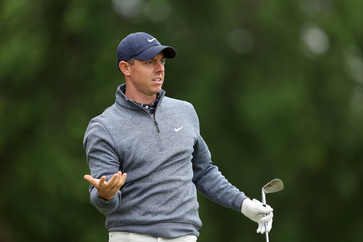 Golfer Rory McIlroy looks confused after a shot.