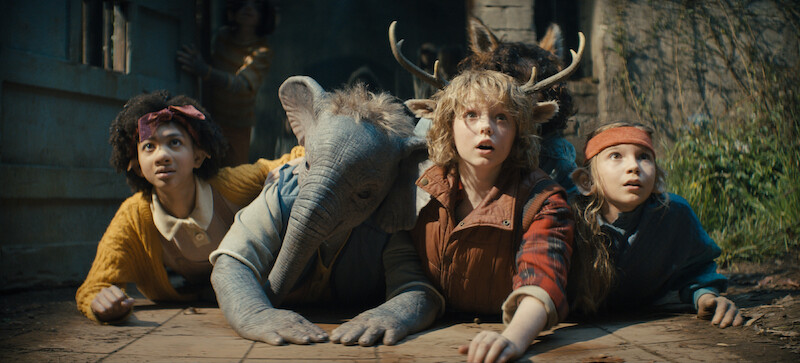 Naledi Murray, Christian Convery and co-stars crouch as hybrid children. 