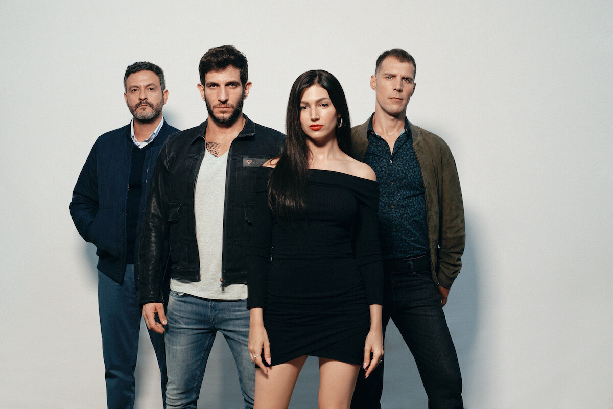 Úrsula Corberó (Money Heist) as Rosa in front of a group of other players