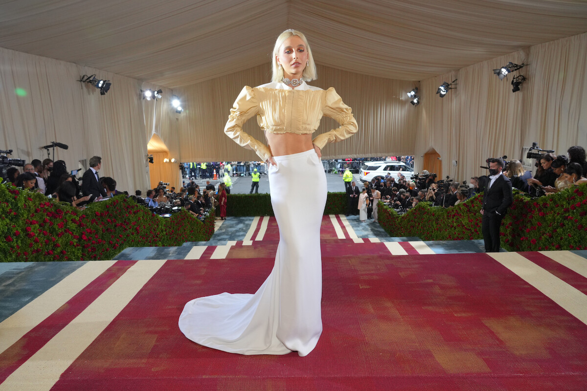 Emma Chamberlain poses on the red carpet at the Met Gala.