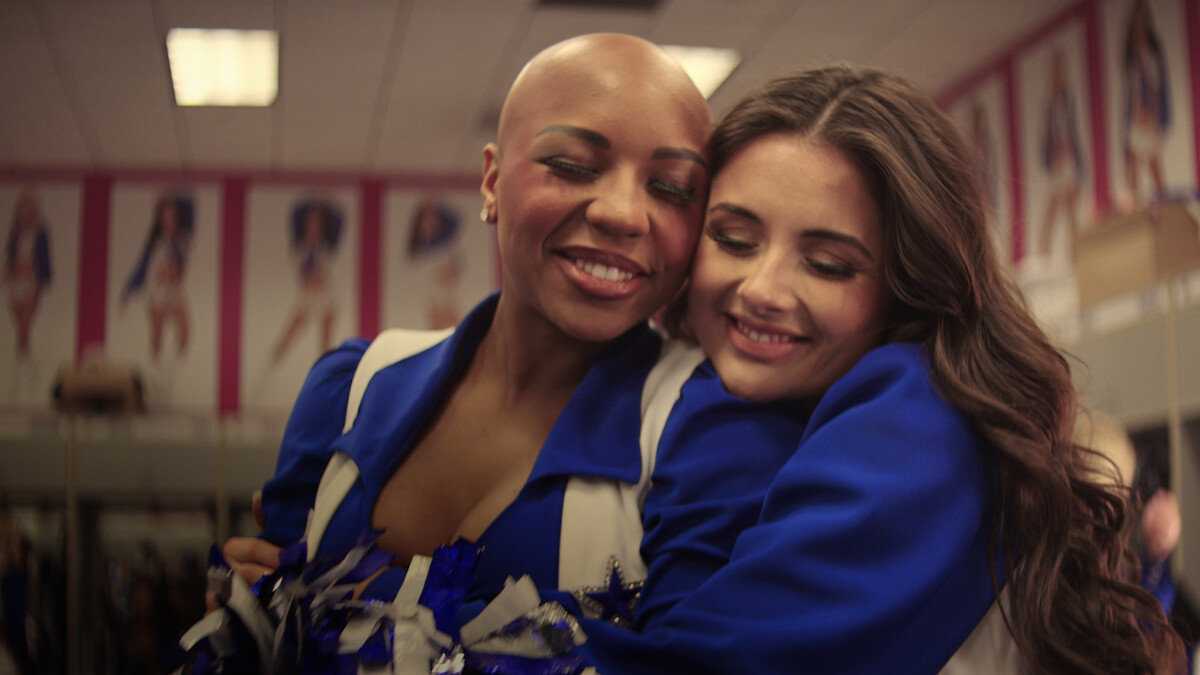 Dallas Cowboys Cheerleaders embracing