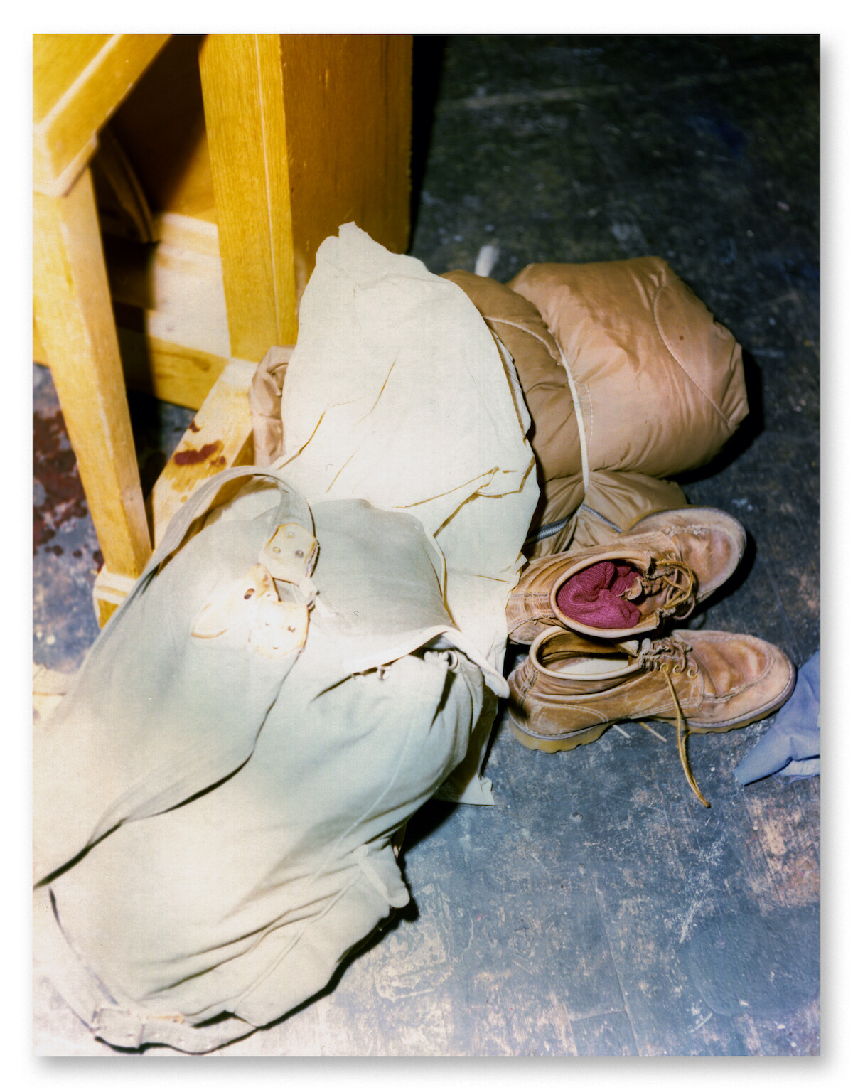 A small pile of Sigrid’s belongings including shoes and a sleeping bag.