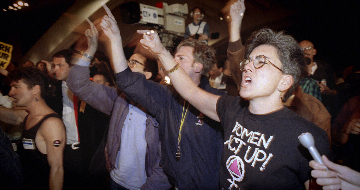 A crowd protesting in a scene from 'Outstanding: A Comedy Revolution'.