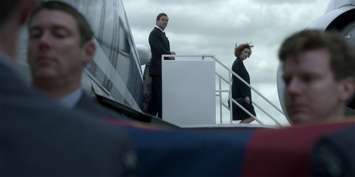 Charles exiting a plane after Flying to Paris