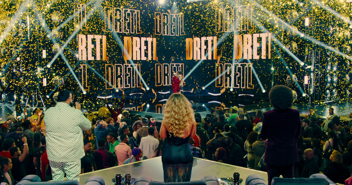 DJ Khaled, Latto, and Ludacris seen from behind as DreTL is announced as the winner of ‘Rhythm + Flow’ Season 2.