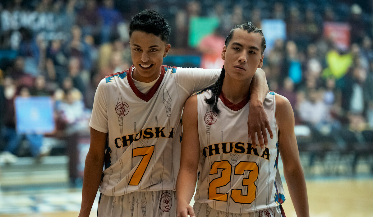 Kauchani Bratt as Jimmy and Kusem Goodwind as Nataanii stand on the court in ‘Rez Ball.’