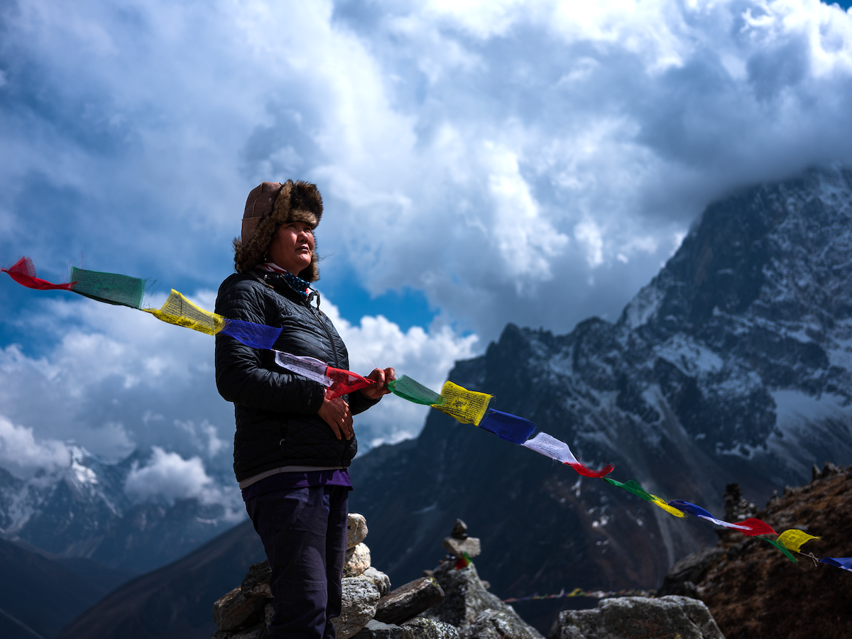 Lhakpa Sherpa on top of a mountain in ‘Mountain Queen: The Summits of Lhakpa Sherpa’