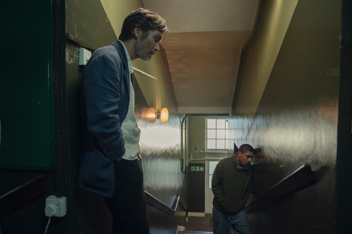 Cillian Murphy as Steve and Jay Lycurgo as Shy standing in a hallway.