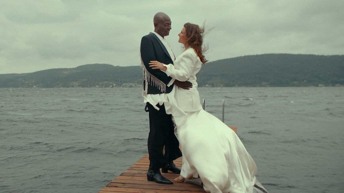 Durek Verrett and Märtha Louise standing on the dock during a pre-wedding event in ‘Rebel Royals.’